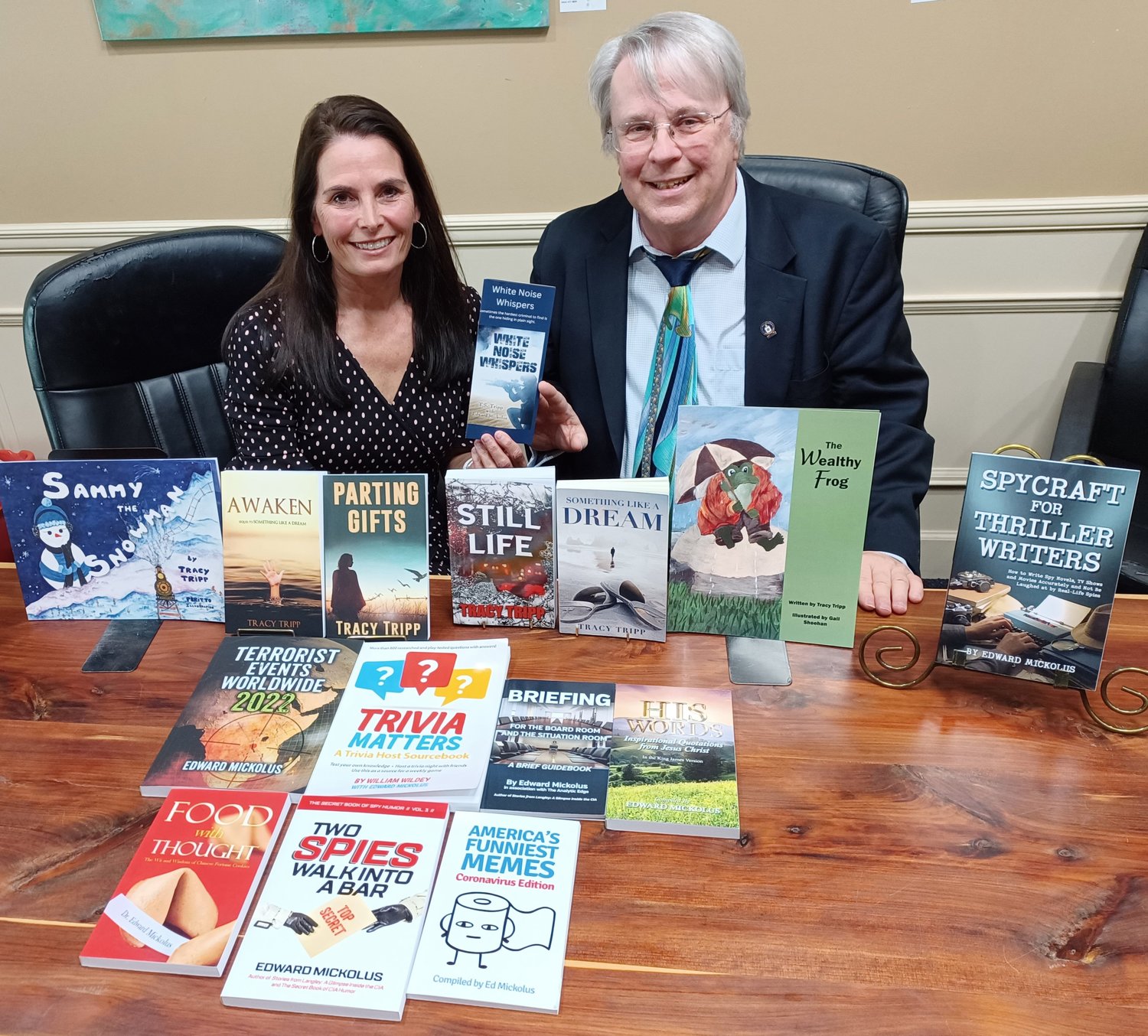 “White Noise Whispers” co-authors Tracy Tripp and Edward Mickolus show off some of their other books. Their new novel will be available for purchase May 8.